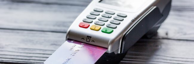 Customer paying at a card terminal